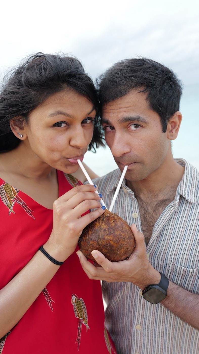 Rishi and Esha sharing a coconut through two straws
